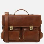 Brown leather messenger bag with two front pockets, gold-tone lock clasps, top handle, and detachable shoulder strap.