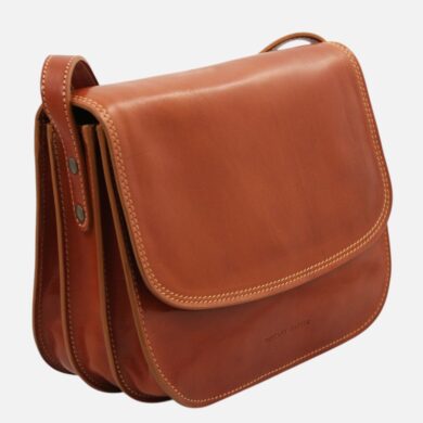 Tan brown leather satchel with a front flap, contrast stitching, and a small top handle; multiple compartments visible on the side.