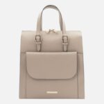 Beige pebbled leather backpack with top handles and a front flap pocket, gold-tone hardware.