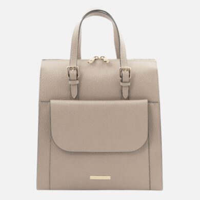 Beige pebbled leather backpack with top handles and a front flap pocket, gold-tone hardware.