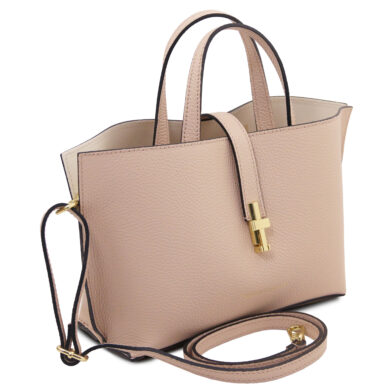 Beige pebbled leather handbag with gold hardware and a detachable shoulder strap.