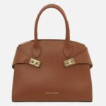 Brown pebbled leather handbag with two top handles and gold-tone buckle straps.