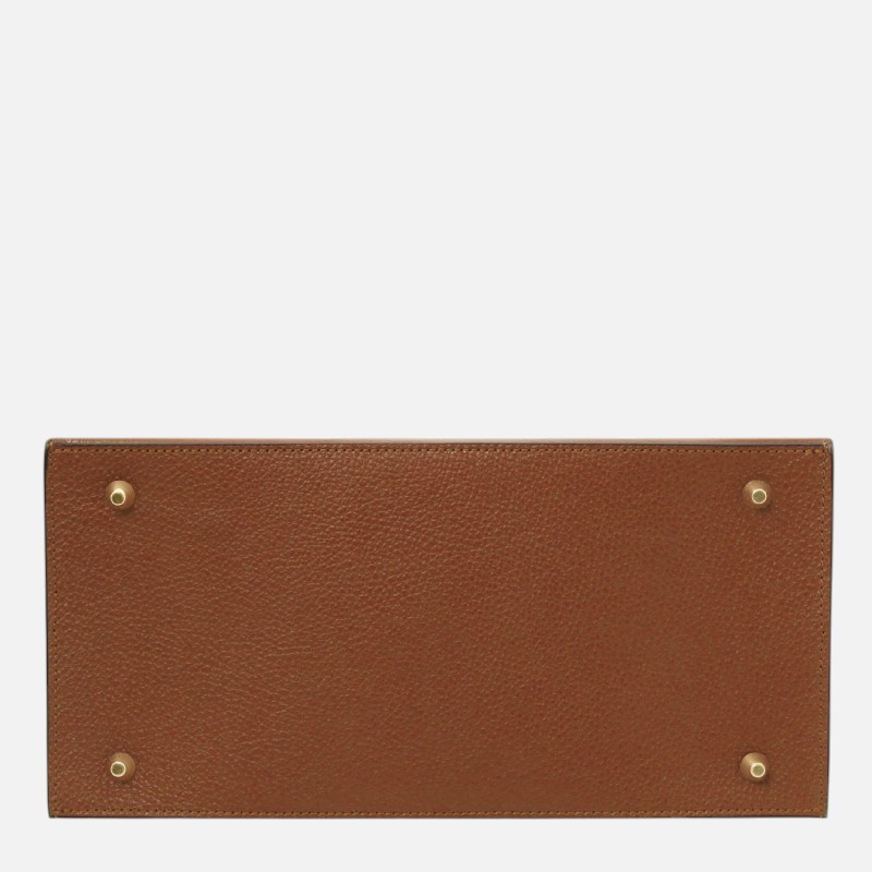 Bottom view of a brown pebbled leather wallet with four brass studs at the corners.