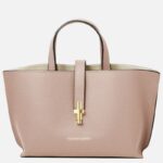 Pink pebble-grain leather tote with two short handles and a central gold clasp closure at the front pocket strap, brand Tuscany Leather visible at bottom.