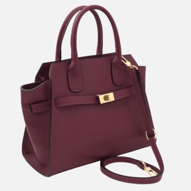 Maroon leather handbag with gold-tone hardware and a detachable shoulder strap viewed at an angle.