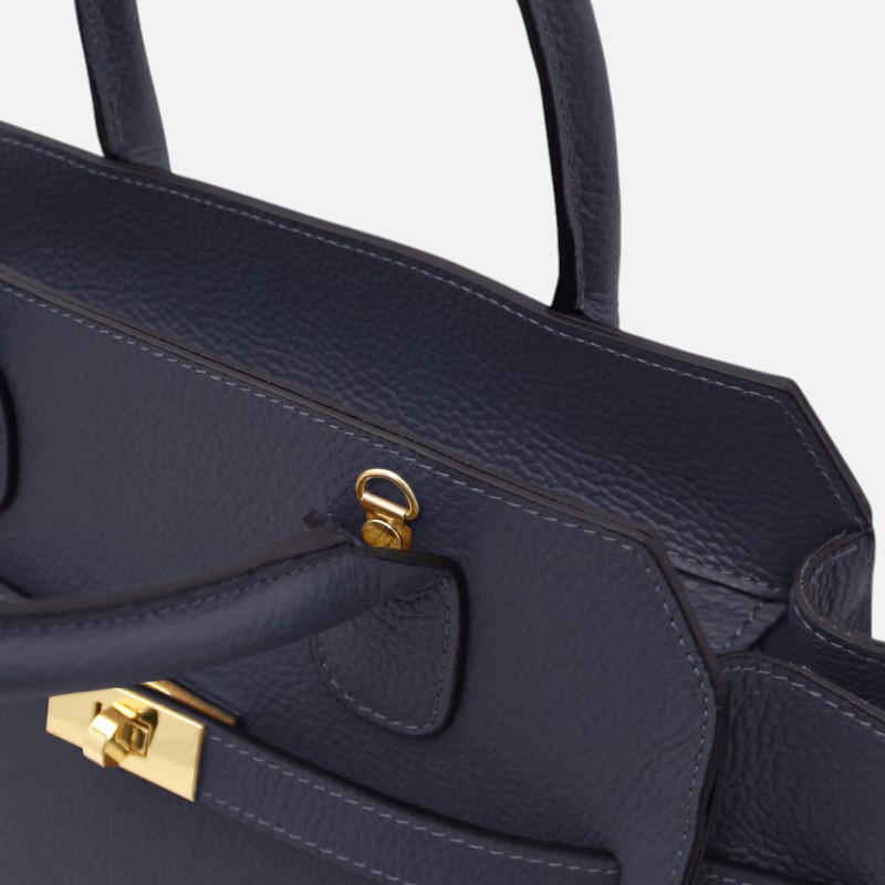 Navy blue leather handbag with gold-tone hardware and a zipper pull.