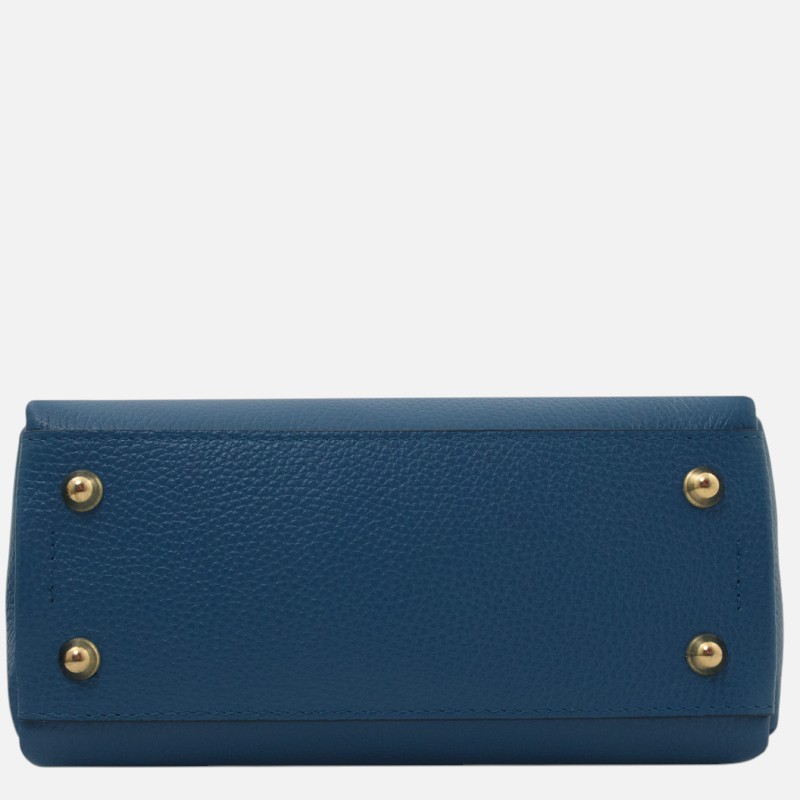 Blue pebbled leather handbag laid on its side, showing the bottom with four gold-tone metal feet