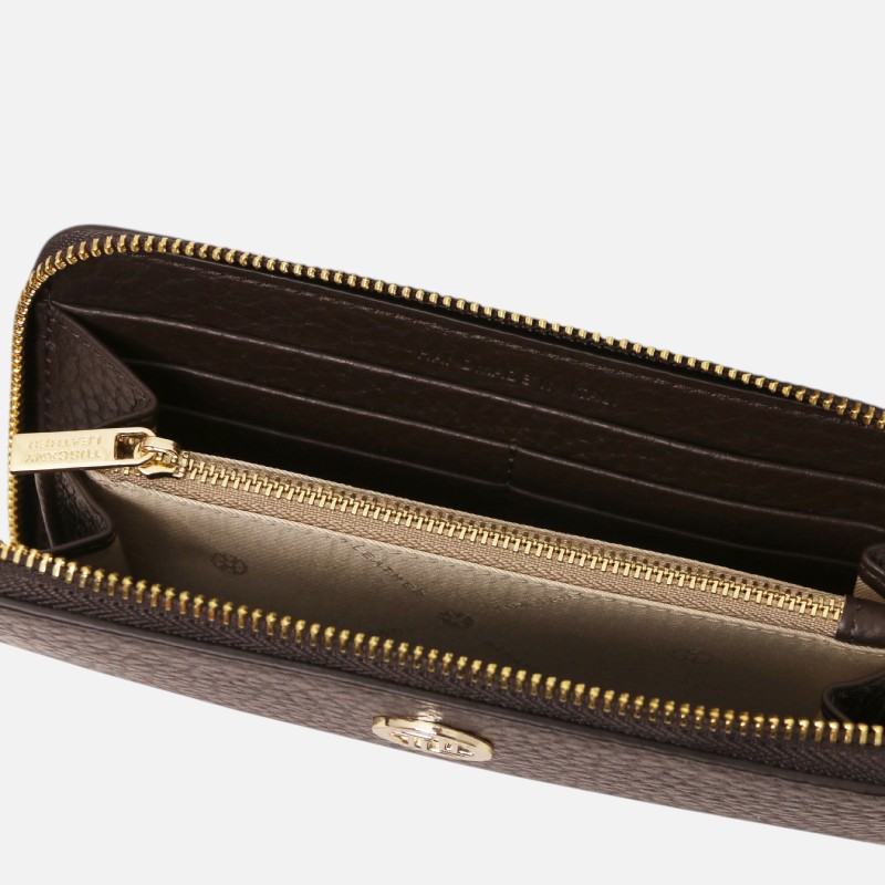 Brown leather wallet with gold zippers and multiple card slots inside