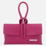 Pink leather clutch with a knotted loop strap and slim rectangular body, front metal brand plaque visible