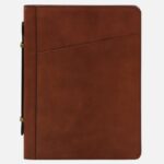Brown leather portfolio with a diagonal front pocket and gold-tone side clasps, showing a sleek, professional organizer (Tuscany Leather).