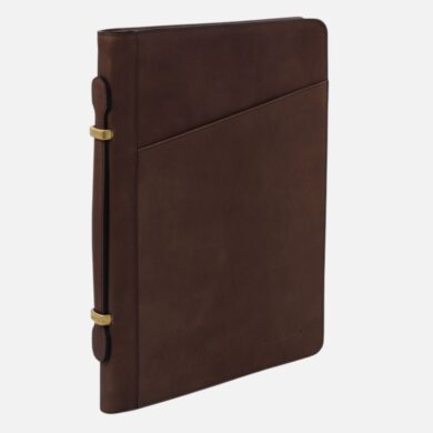 Brown leather folio with diagonal front pocket and gold-tone side clasps, standing upright against a light background for a product image.