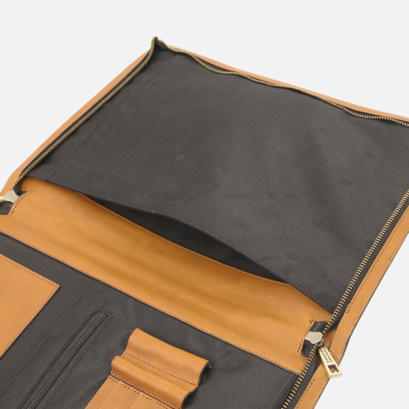Open leather tool roll organizer with tan exterior and dark grey interior, showing pockets and zippered compartments ready for tools or accessories.