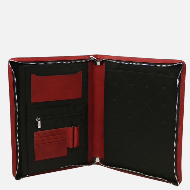 Red leather zippered organizer opened to reveal card slots, an ID window, and pen holders inside black lining.