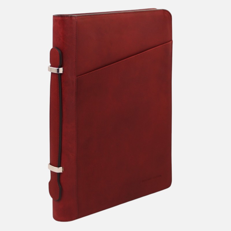 Red leather portfolio binder with a diagonal front pocket and beige strap accents, standing upright.