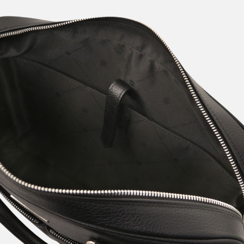 Open black leather handbag with zipper fully unzipped, showing quilted black lining and an internal leather strap loop.