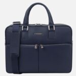 Navy blue leather briefcase with top handles and a detachable shoulder strap, front zip pockets visible on the front panel.