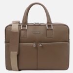 Brown textured leather bag with two top handles, a beige detachable shoulder strap, and front dual zip pockets with a small metal logo plate.