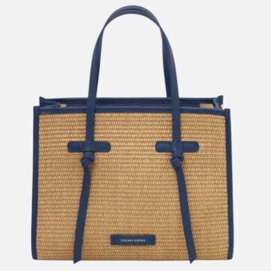 Straw tote bag with blue leather trim and two handles, front view