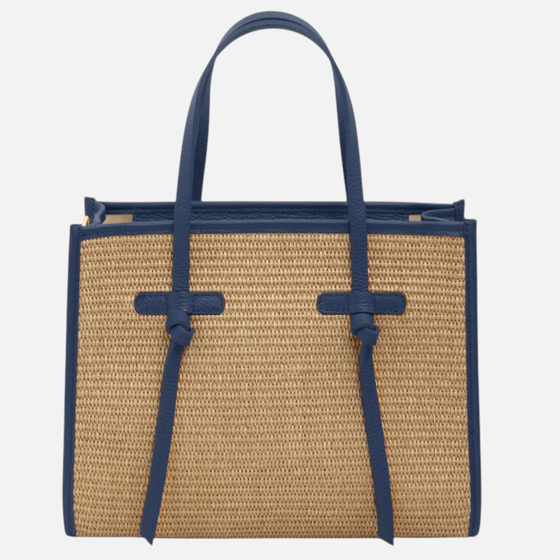 Woven straw tote bag with blue leather trim and handles.