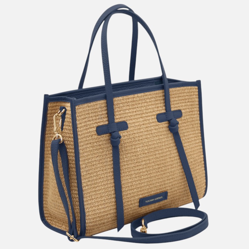 Woven straw tote bag with blue leather trim and handles, plus detachable shoulder strap.