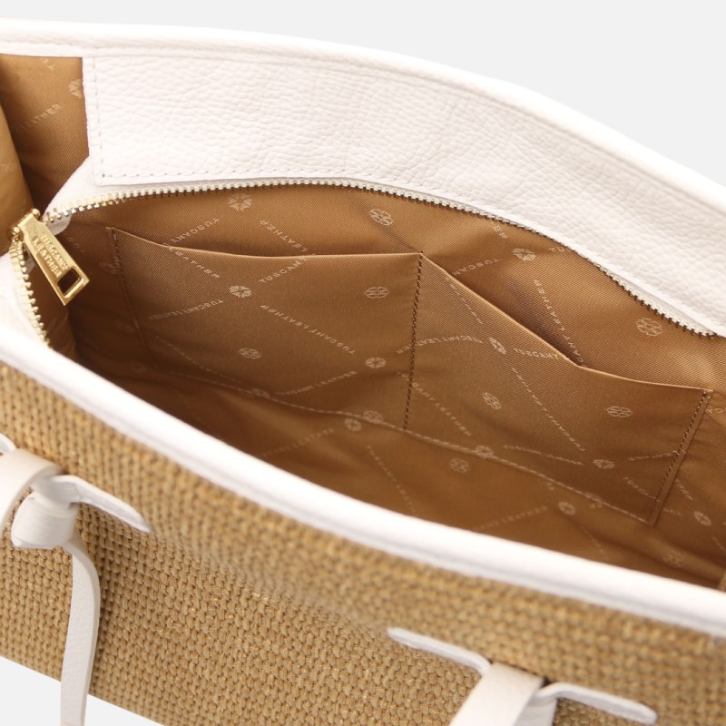 Open tote bag interior with tan lining and multiple pockets for organizing items.