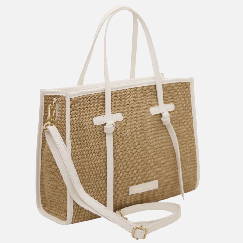 Woven straw tote with white leather trim, two top handles, and a detachable white strap with gold-tone accents.