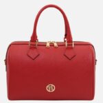 Redpebbled leather handbag with two top handles and gold-tone hardware, bottom gold logo plate, front view.