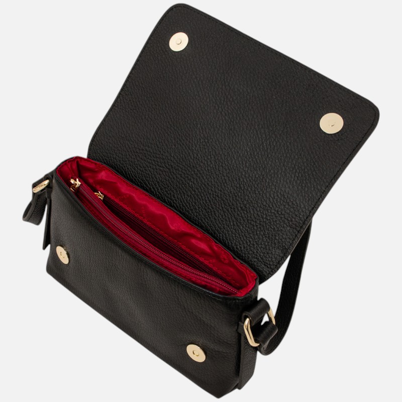 Black pebbled leather crossbody bag with a flap open to reveal a red interior and gold hardware; zipper pocket inside base.