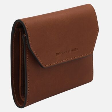 Brown leather wallet with visible stitching and the 'Tuscany Leather' brand on the flap, shown from a side angle.