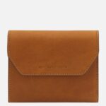Brown leather wallet with stitched edges and a subtle 'Tuscany Leather' brand emboss on the front
