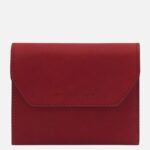 Red leather wallet with a flap closure and subtle stitching, branded Tuscany Leather at center front.