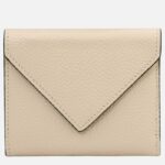 Beige leather wallet with envelope-style flap and stitched edges on plain background