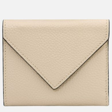 Beige leather wallet with envelope-style flap and stitched edges on plain background
