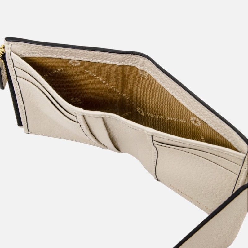 Beige leather wallet opened to show card slots and a brown branded interior lining.