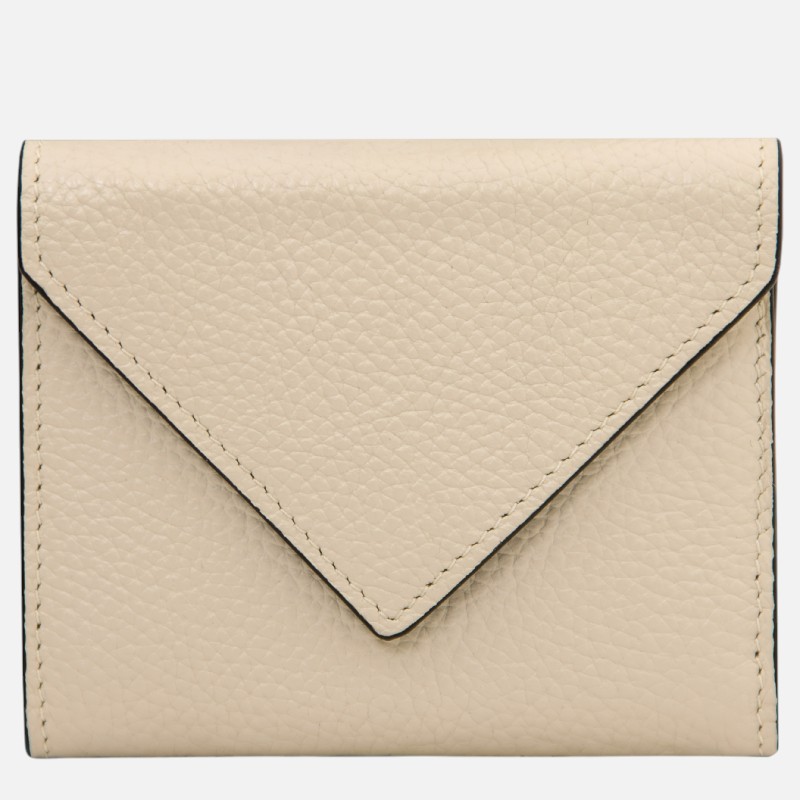 Beige leather wallet with envelope-style flap and stitched edges on plain background