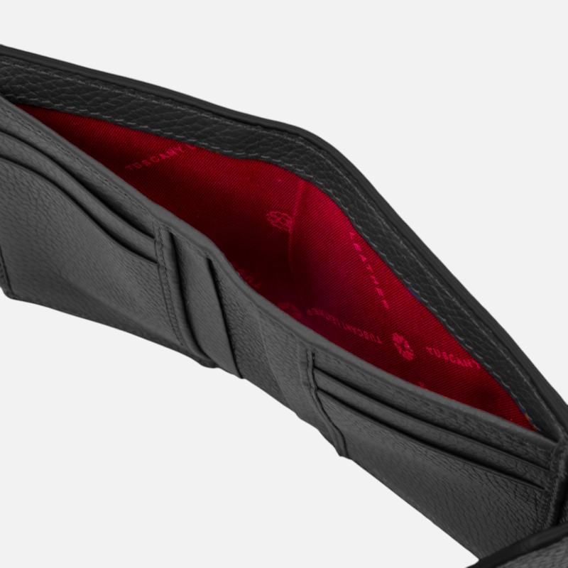 Black leather wallet opened to show red fabric lining and card slots inside