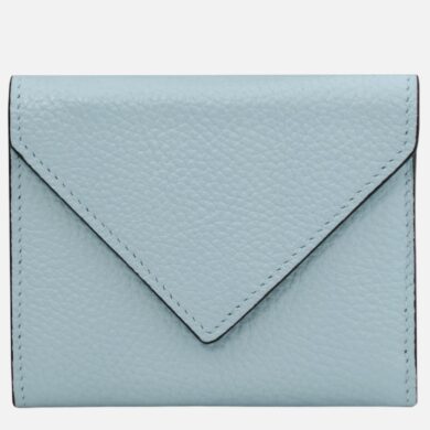 Light blue pebbled leather wallet with an envelope-style flap, viewed from the front.