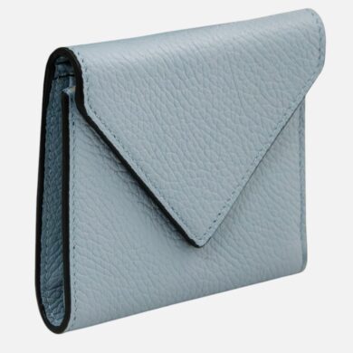 Blue leather envelope clutch wallet with a flap over fold and textured grain surface