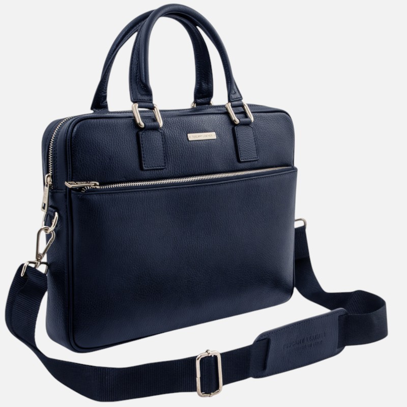 Navy blue leather briefcase with top handles and a detachable shoulder strap, front zip pocket visible.