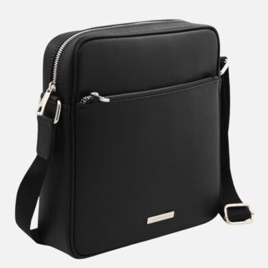 Black leather crossbody bag with a front zip pocket, silver hardware, and an adjustable shoulder strap; brand plate visible on the lower front.