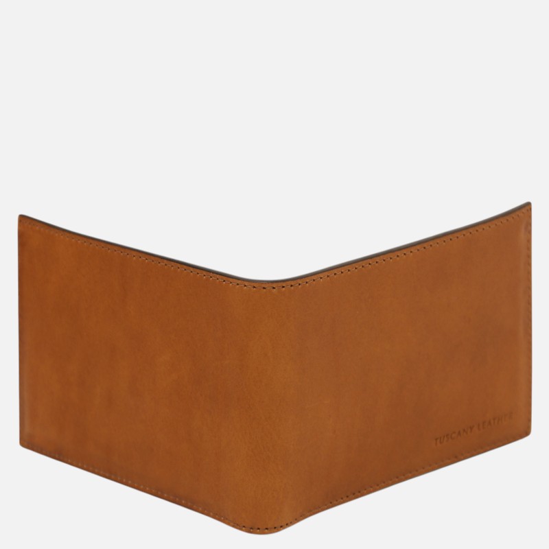 Tan leather wallet with a curved top edge and a Tuscany Leather imprint in the bottom-right corner.