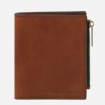 Brown leather zippered wallet with visible stitching and the 'Tuscany Leather' logo on the front.