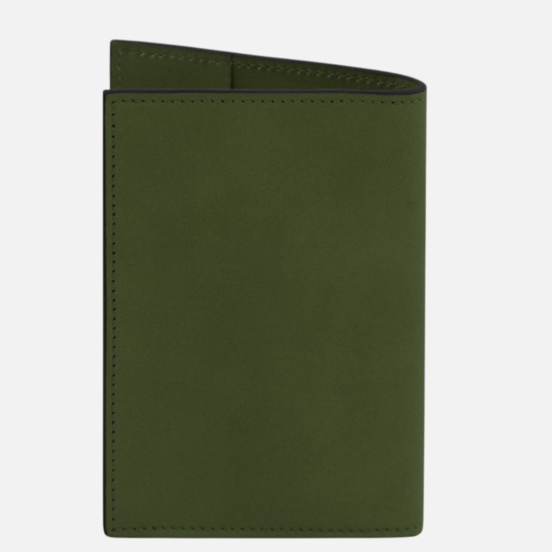 Olive green leather notebook with stitched edges, closed.