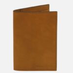Tan leather wallet standing upright with visible stitching and the 'TUSCANY LEATHER' logo at the bottom edge.