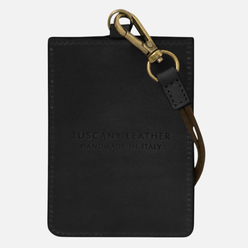 Black leather cardholder with brown strap and brass clasp, embossed with 'TUSCANY LEATHER HANDMADE IN ITALY'