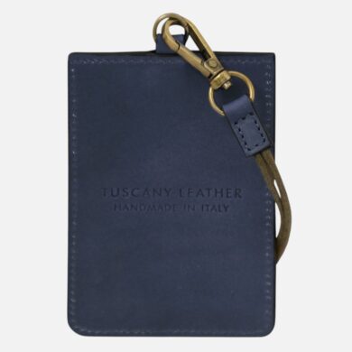Navy leather card holder with tan strap and brass clip