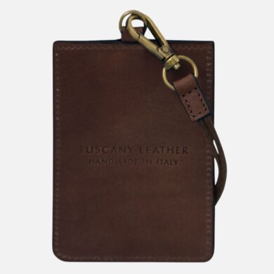 Brown leather cardholder with metal clip and strap, engraved 'Tuscany Leather Handmade in Italy'