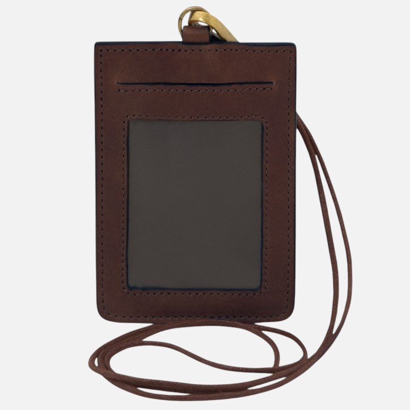 Brown leather ID badge holder with clear window and lanyard, hanging strap visible at top and around the card slot area.