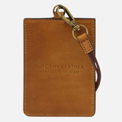 Brown leather cardholder with brass key ring and strap, embossed 'TUSCANY LEATHER HANDMADE IN ITALY'