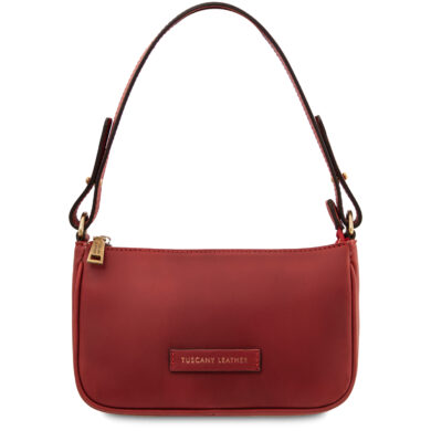 Red leather shoulder bag with a rounded bottom, top zipper, and a gold-toned zipper pull; brand tag reads Tuscany Leather on the front.